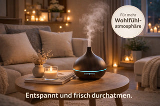 Diffusore a ultrasuoni scuro su tavolino con candele e atmosfera rilassante