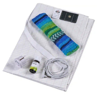 Kit completo per la messa a terra con lenzuolo in argento, cuscino alle erbe, olio essenziale e cavo di collegamento.