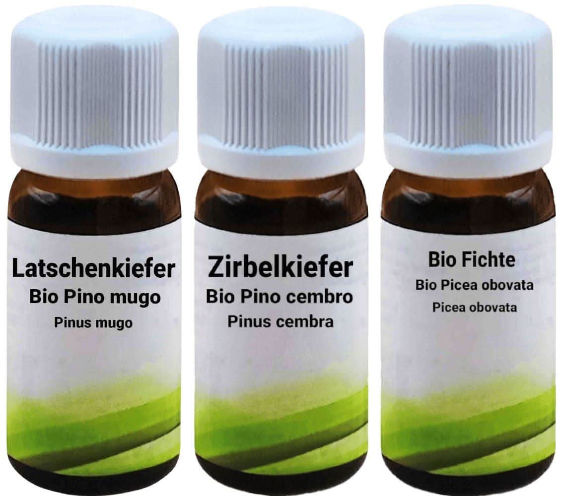 Woody Scent Set with bottles in front of a blurry forest background